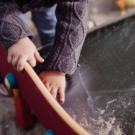 Child playing in a sandbox.